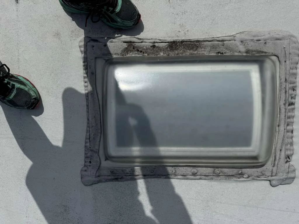 RV skylight being sealed and repaired on a roof in Palm City FL